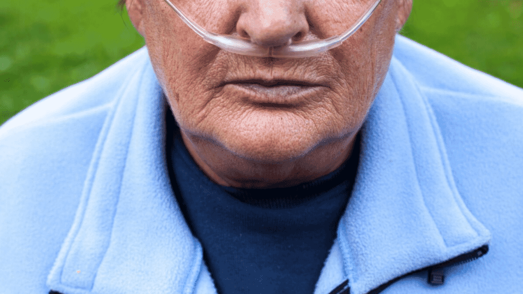 Man with portable oxygen concentrator